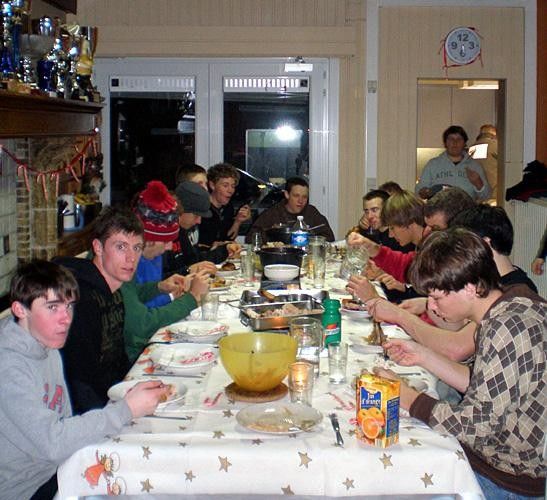 The riders sit down for dinner