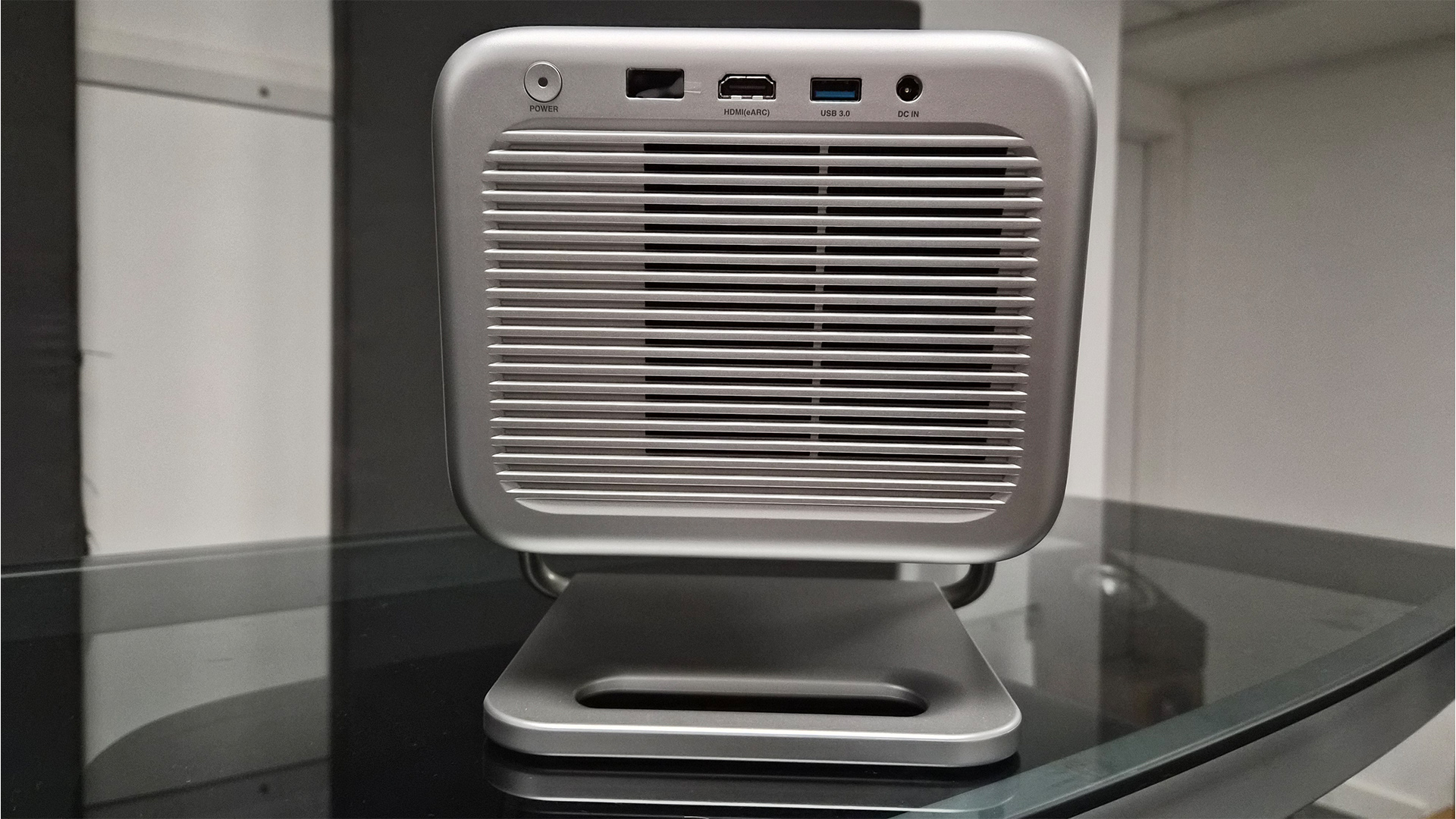 Hisense M2 Pro lifestyle projector rear of projector on glass coffee table