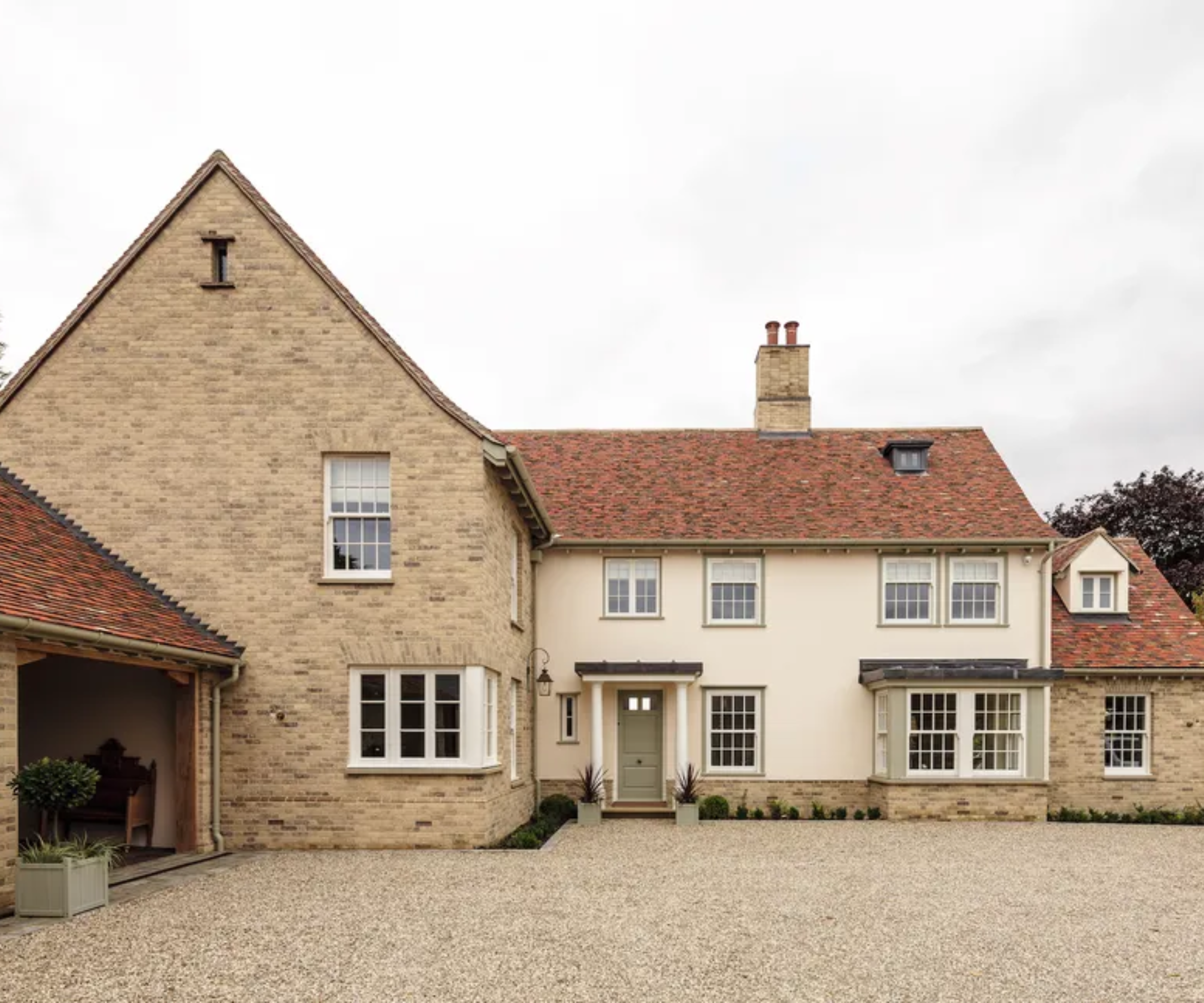 Country-style house with beige gravel at the front