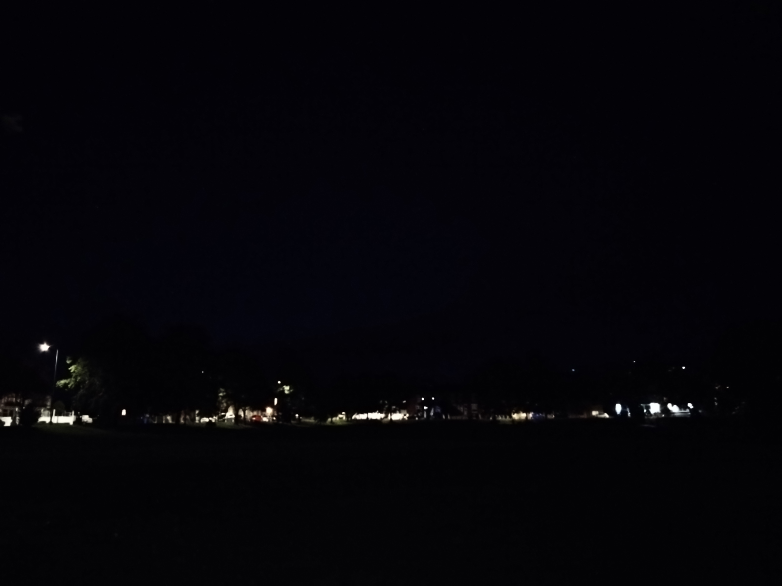 Sony Xperia 10 IV camera sample showing an open green space in the dark