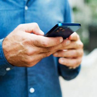 Close shot of a man holding a mobile phone