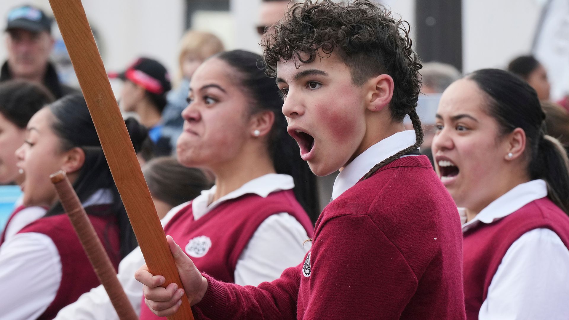 
                                Students perform a haka during a parade celebrating Maori Language Week in Wellington, New Zealand
                            