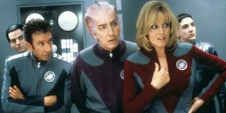 Galaxy Quest Tim Allen, Alan Rickman, and Sigourney Weaver standing on the bridge, in conversation