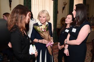 The Duchess of Cornwall chats with (left to right) CEO of SafeLives Suzanne Jacob, and SafeLives Pioneers Celia Peachey and Rachel Williams during a reception for the 15th anniversary of the domestic abuse charity SafeLives, at Clarence House in London.