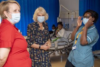 Britain's Camilla, Duchess of Cornwall and Patron of Roald Dahl's Marvellous Children's Charity,shares a light moment with staff during a visit to The Whittington Hospital, north London on May 12, 2021, on the occasion of International Nurses' Day.