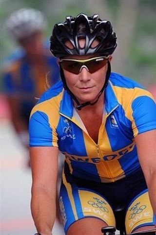 Sara Mustonen, of Sweden's cycling team, practices near the Great Wall of China