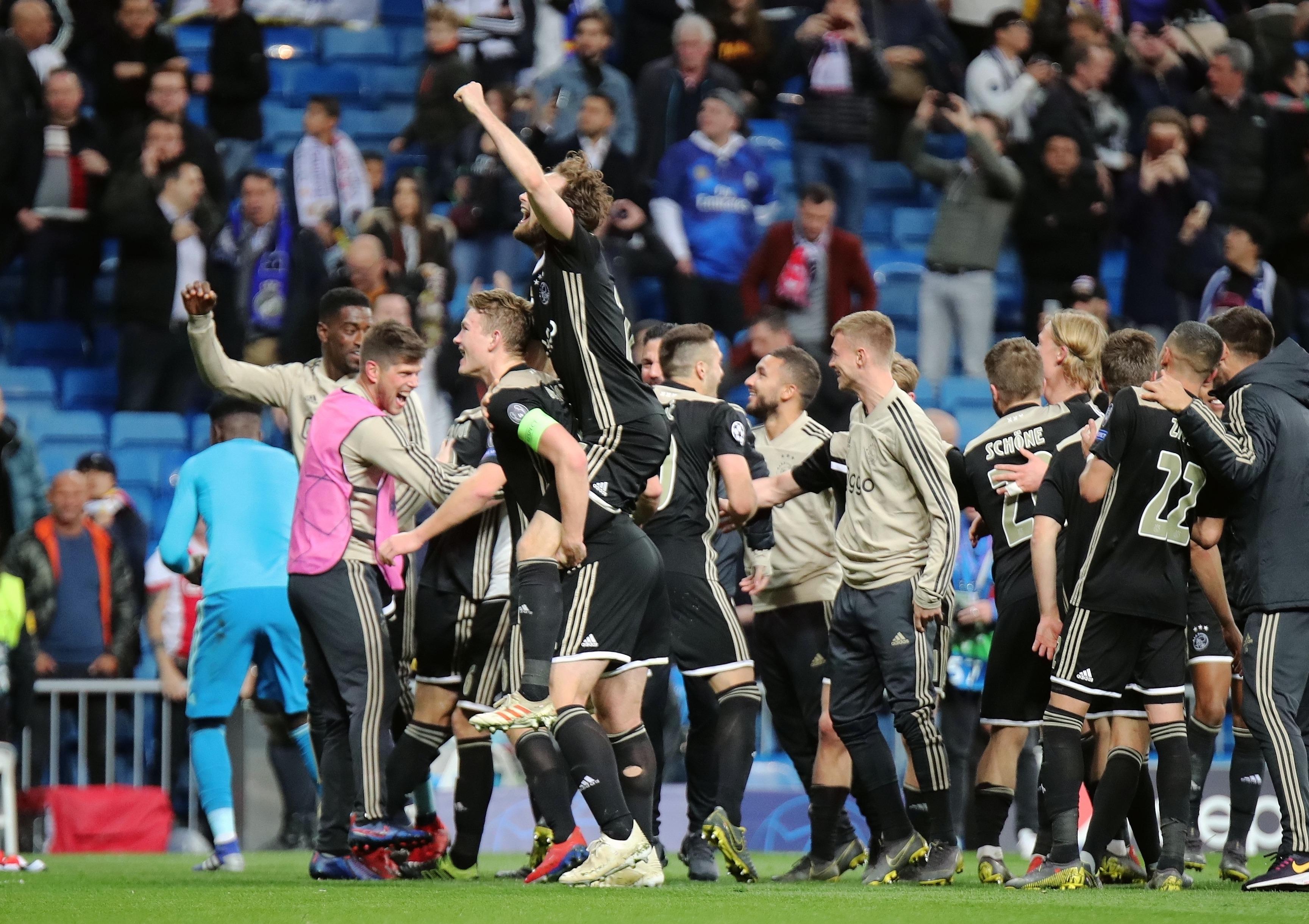 Ajax players celebrate after beating Real Madrid on aggregate in the last 16 of the 2018/19 Champions League