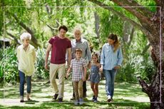 Multigenerational family walking in the woods