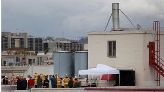 Authorities gathered on the roof of the Cecil Hotel on Main Street, in downtown Los Angeles, following the discovery of a body in the hotel's water tank, which authorities believe to be that of missing Canadian tourist Elisa Lam, 21, Feb. 19, 2012. Lam was last seen three weeks ago at the Cecil Hotel. (Photo by Jay L. Clendenin/Los Angeles Times via Getty Images)
