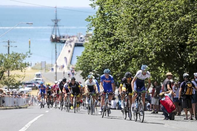 The peloton stretch out up the climb