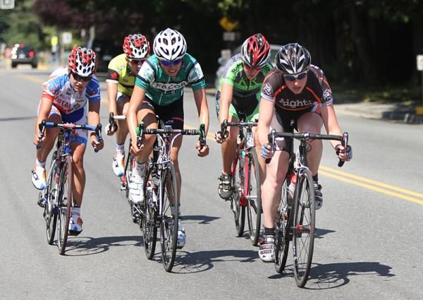 Webcor rider Angela McClure (centre) rides in the break at the Tour de Delta.