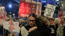 People react to the reports of a possible Gaza cease fire and hostage release deal being reached during a rally calling for the return of hostages held in the Gaza Strip on January 15, 2025 in Tel Aviv, Israel. A ceasefire deal between Israel and Hamas was announced tonight that would entail the release of Israeli hostages held in Gaza, according to officials from Hamas, the United States, and other parties