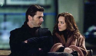 Eric Bana and Rachel McAdams share a meaningful look on a bench in The Time Traveler's Wife.