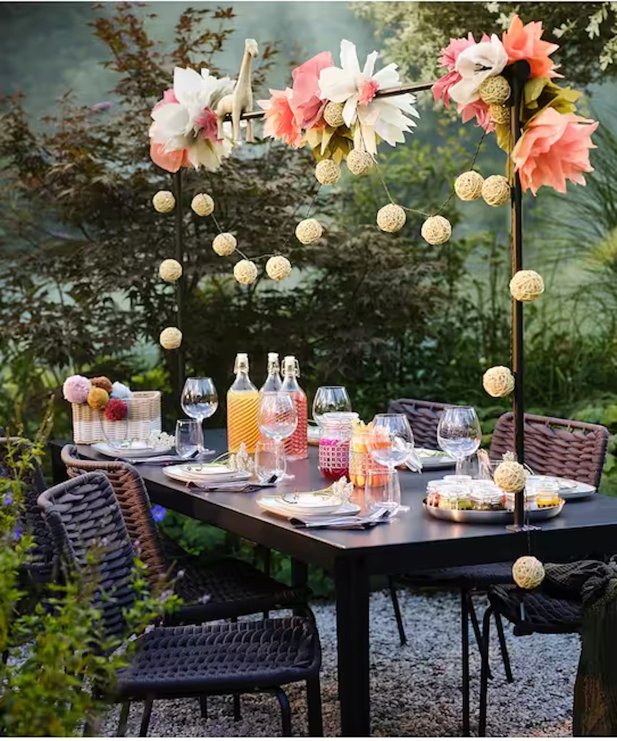 outdoor dining table with over table rod and fairy lights
