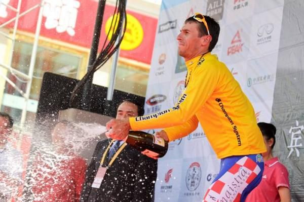 Radoslav Rogina (Loborika) lets the bubbly spray wearing the leaders jersey.