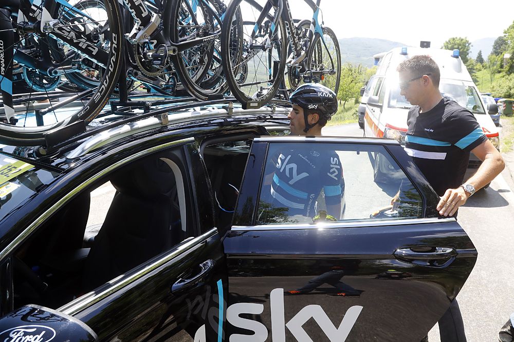 Spanish cyclist Mikel Landa (C) of team Sky boards the team's car during the 10th stage of the 99th Giro d'Italia