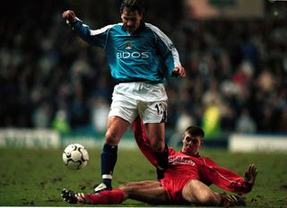 Manchester City's Andrei Kanchelskis skips past Liverpool's Steven Gerrard in a game in January 2001.