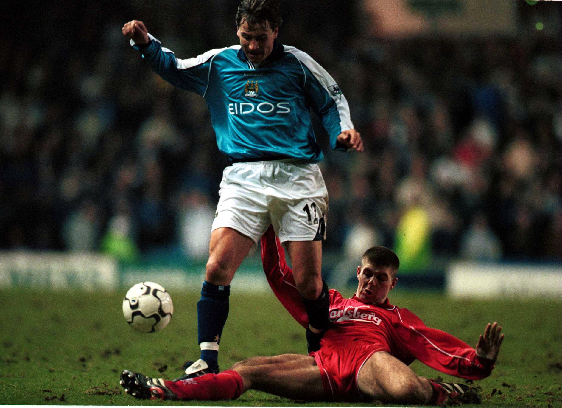 Manchester City's Andrei Kanchelskis skips past Liverpool's Steven Gerrard in a game in January 2001.