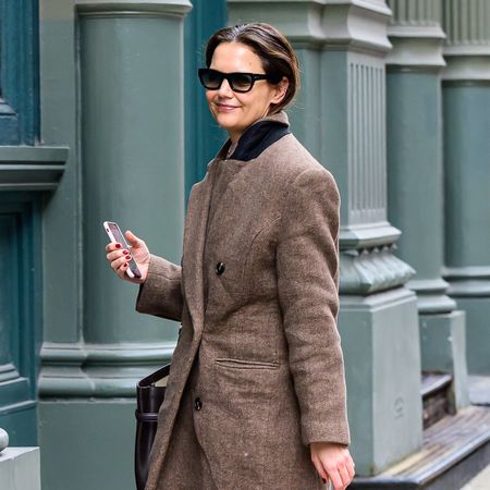 Katie Holmes wearing a brown coat in NYC