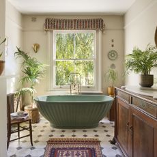 BC Designs green bathtub in traditional bathroom