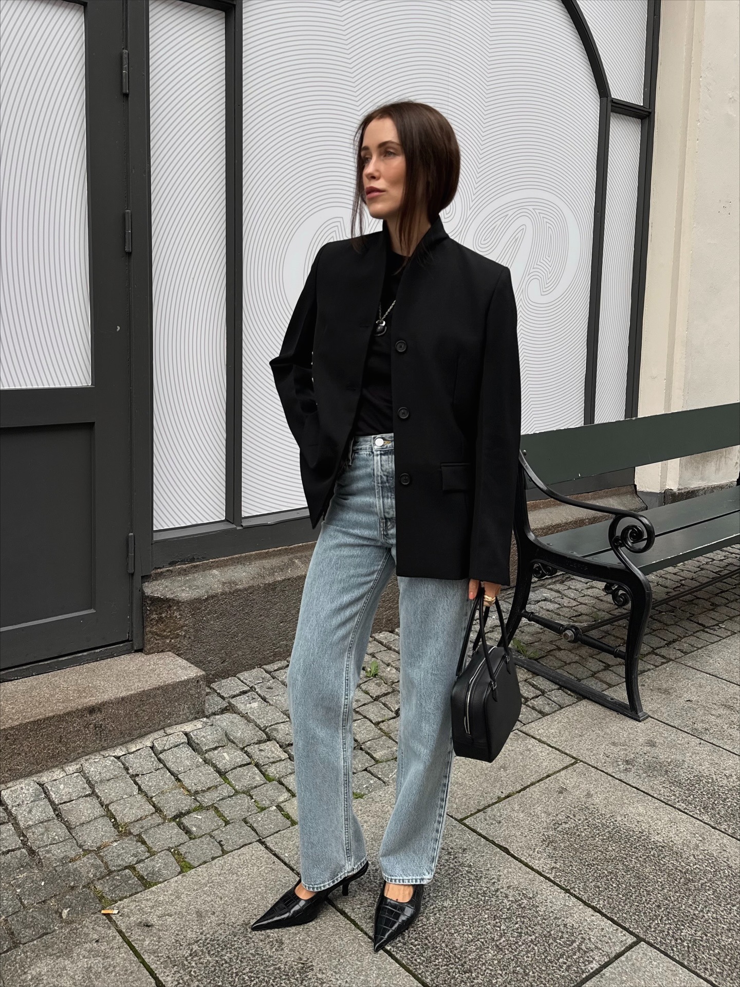 Influencer wearing light-wash jeans and heels