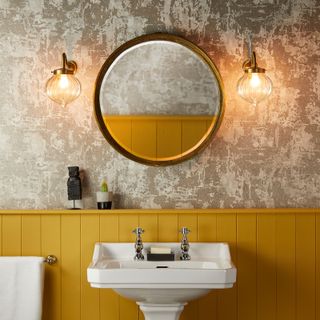 bathroom with yellow painted wainscoting panels