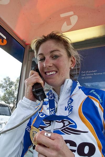 More gold mum: Melbourne's Joanne Hogan (Jayco VIS) phones home to tell them the good news, another gold medal in the Victorian Open Road Cycling Championships.