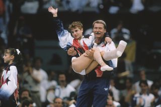 kerri strug being carried by her coach