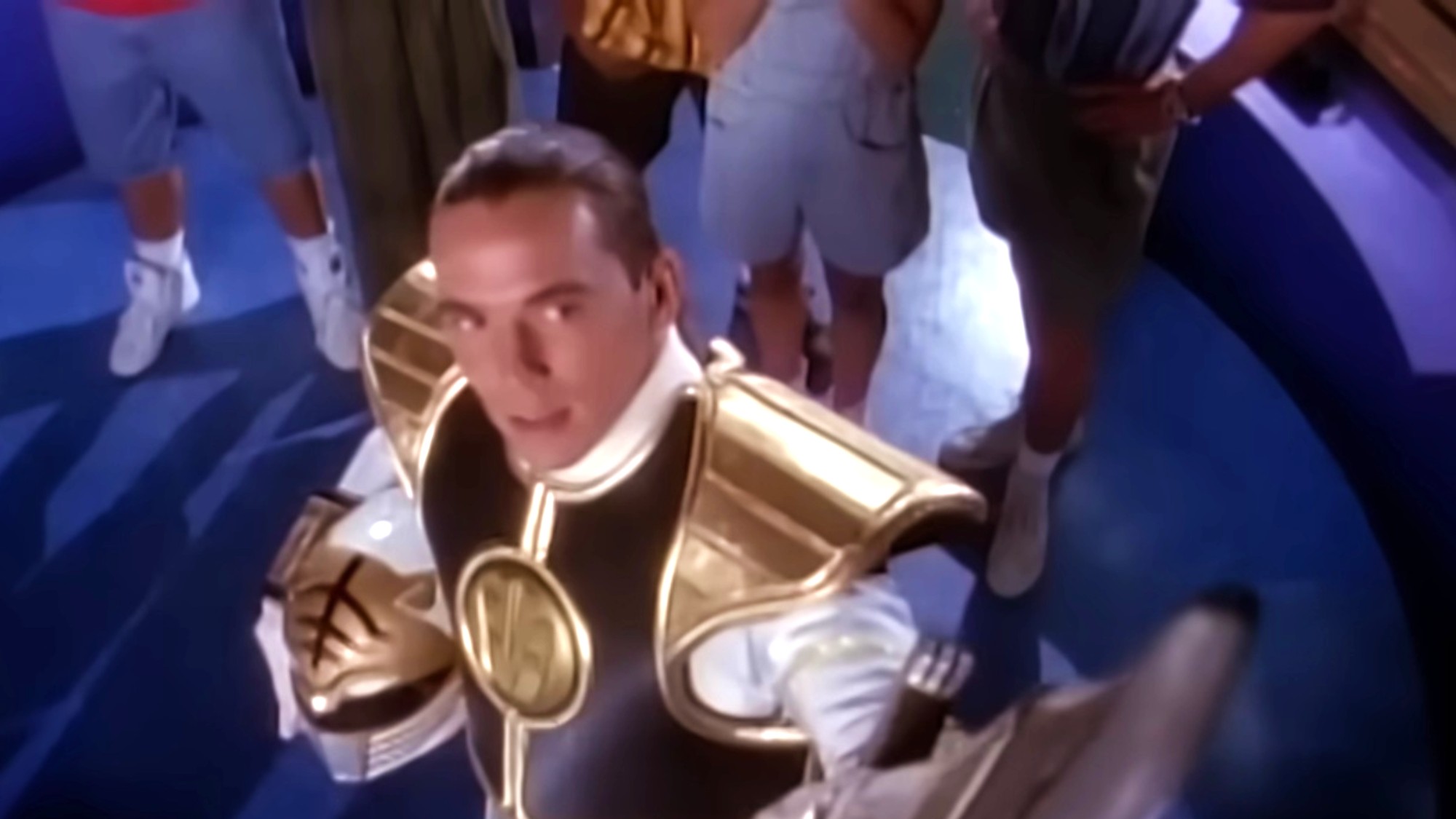 Jason David Frank staring upward as the White Ranger in Mighty Morphin Power Rangers