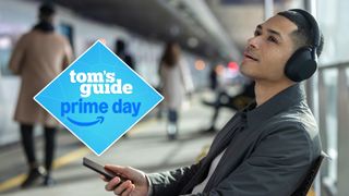 Man wearing Sony WH-1000XM5 headphones while listening to music from his phone