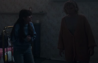 Amaya and Iris standing together in her room