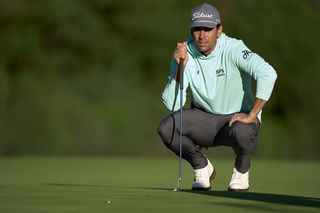 Tour player Rafa Cabrera Bello lines up a putt on the putting green