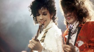 DETROIT, MI - NOVEMBER 4: American singer, songwriter, musician, record producer, dancer, actor, and filmmaker Prince (1958-2016) and American guitarist, singer-songwriter and member of the Revolution Wendy Melvoin perform onstage during the 1984 Purple Rain Tour on November 4, 1984, at the Joe Louis Arena in Detroit, Michigan. (Photo by Ross Marino/Getty Images)