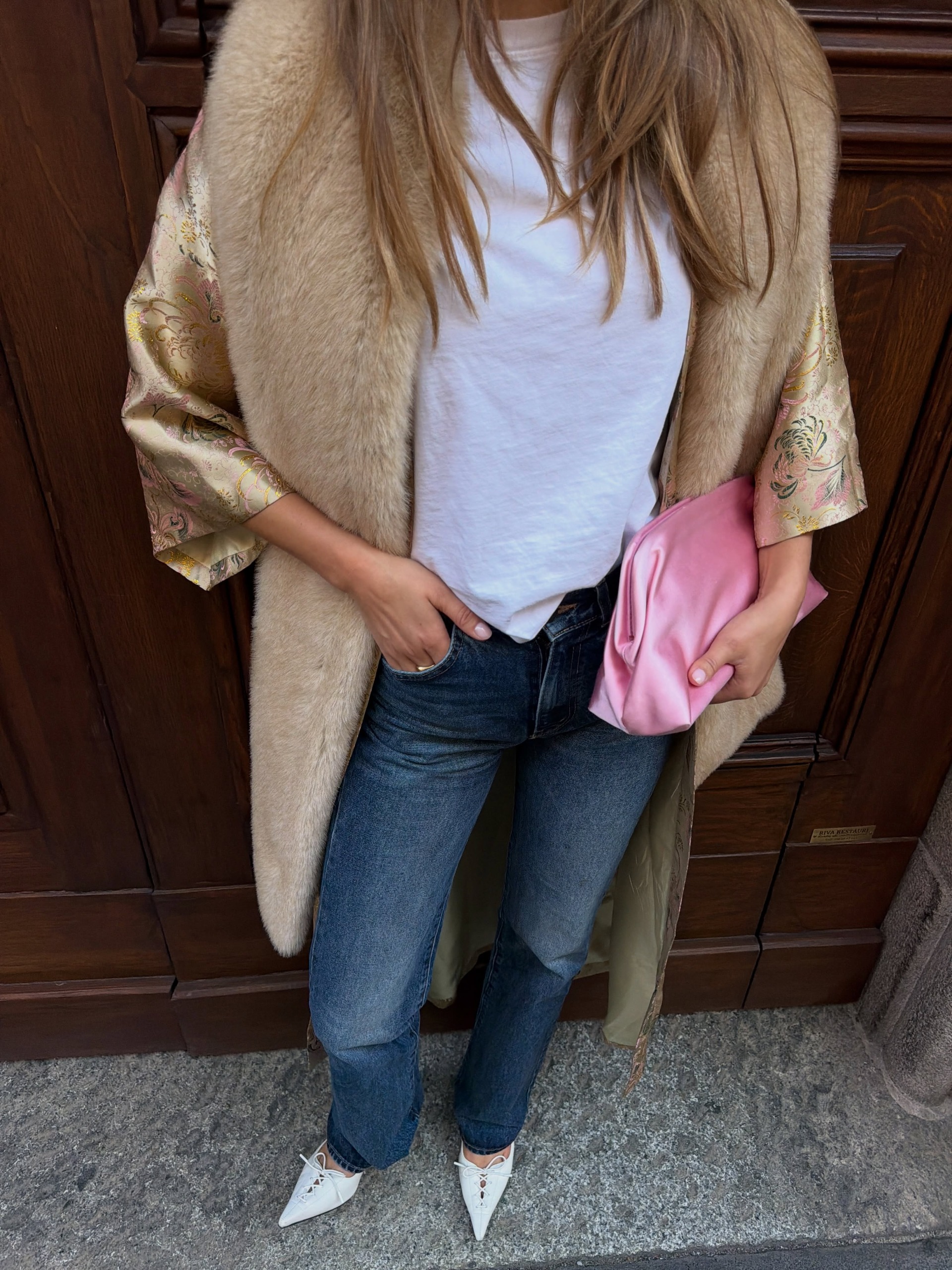 A woman wearing a new fall 2026 denim outfit idea.