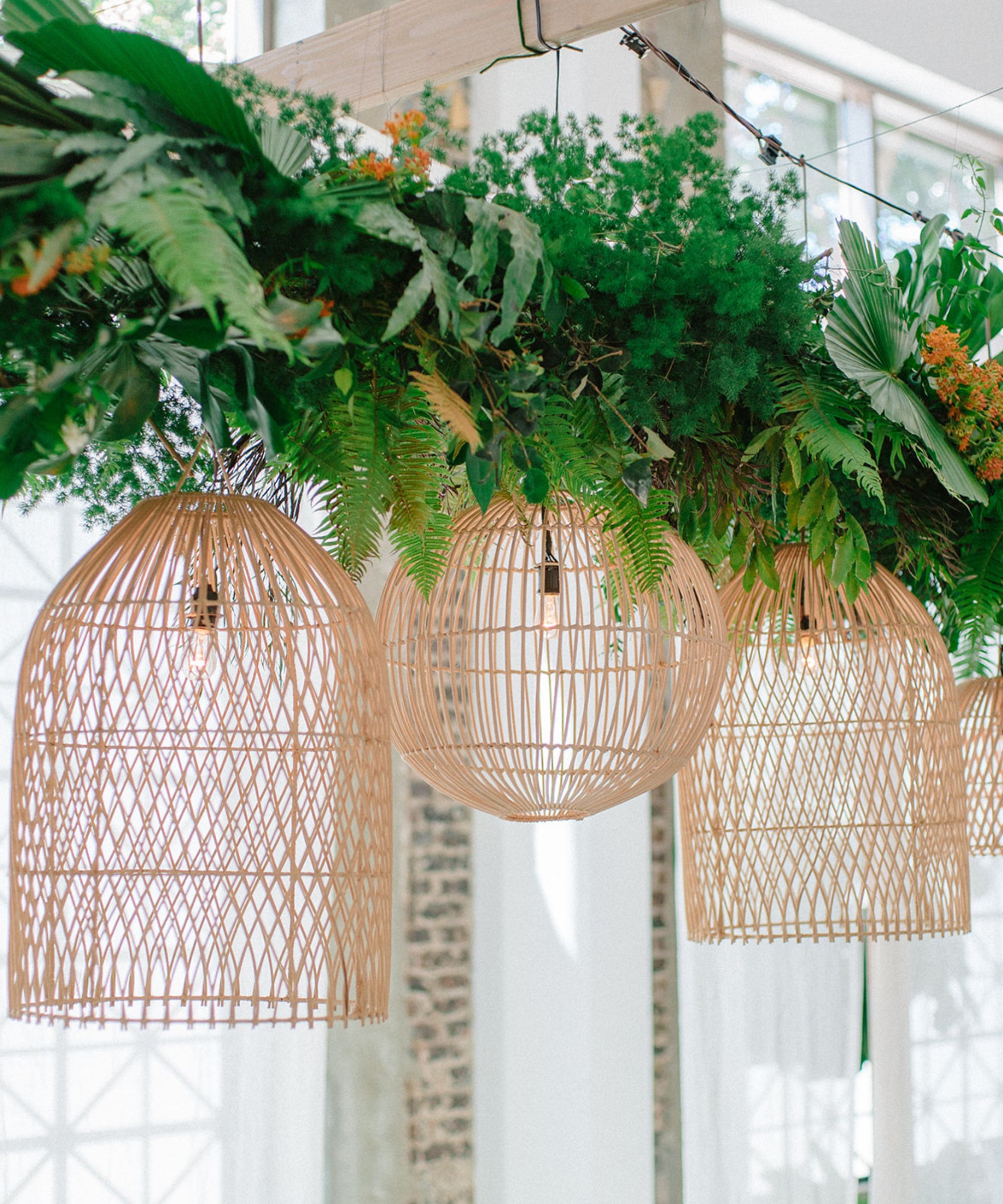 overhead woven lighting pendants with greenery