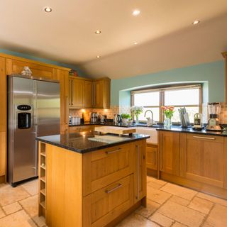 wooden kitchen with worktop and cabinets
