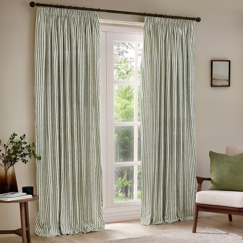 green and white striped curtains in front of white panelled door