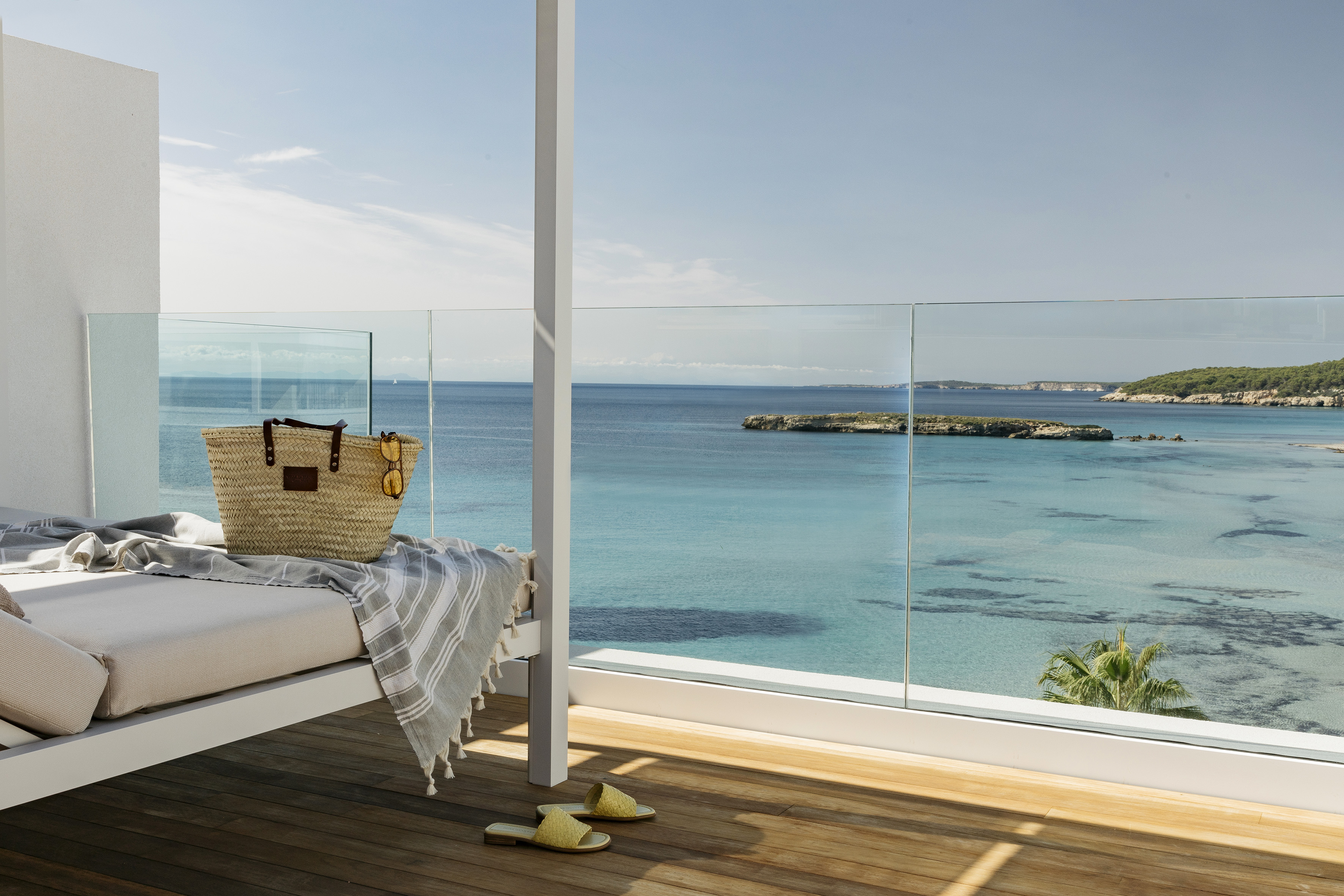 the view of the mediterranean from the balcony of a hotel room at menorca's villa la blanc