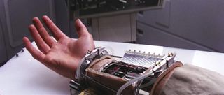 Screenshot from Star Wars showing Luke Skywalker's bionic arm.