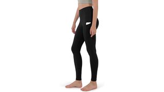 A model wearing black high-waisted leggings with pockets for the best leggings on Amazon.