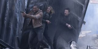 Sam Wilson/Falcon (Anthony Mackie) with The Winter Soldier (Sebastian Stan) and Agent 13 (Emily Van Camp) in a gun fight in The Falcon And The Winter Soldier