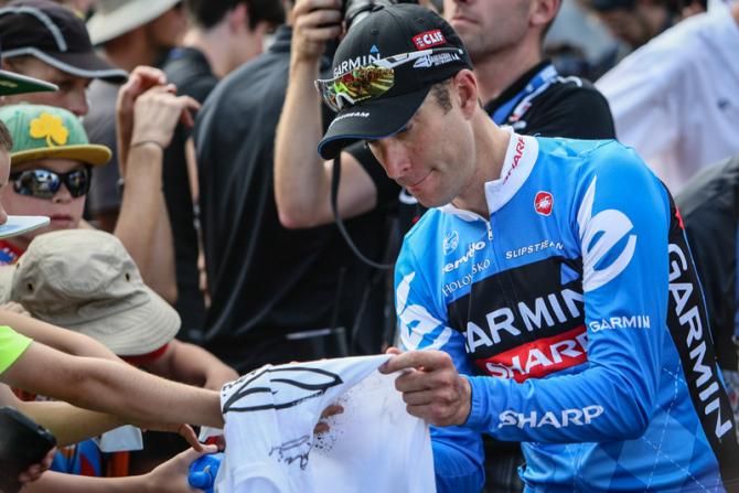 Christian Vande Velde (Garmin-Sharp) signs fans for autographs after the race.