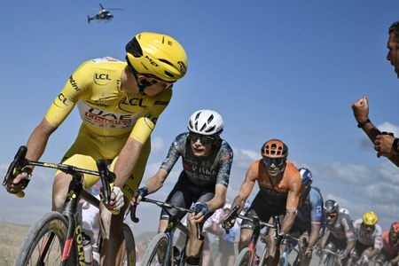 Tadej Pogačar at the Tour de France with a helicopter