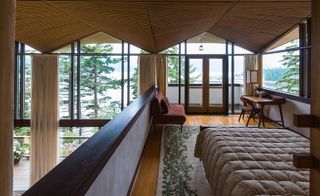 The interior is framed by hyperbolic paraboloids and floor to ceiling windows