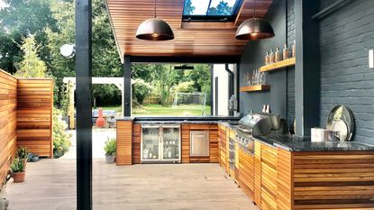 a timber outdoor kitchen under cover