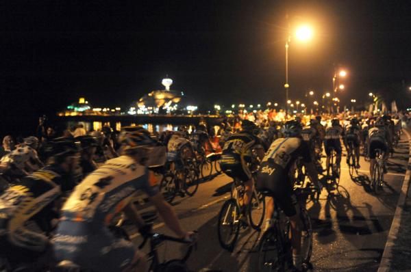 The peloton rides through the Oman night