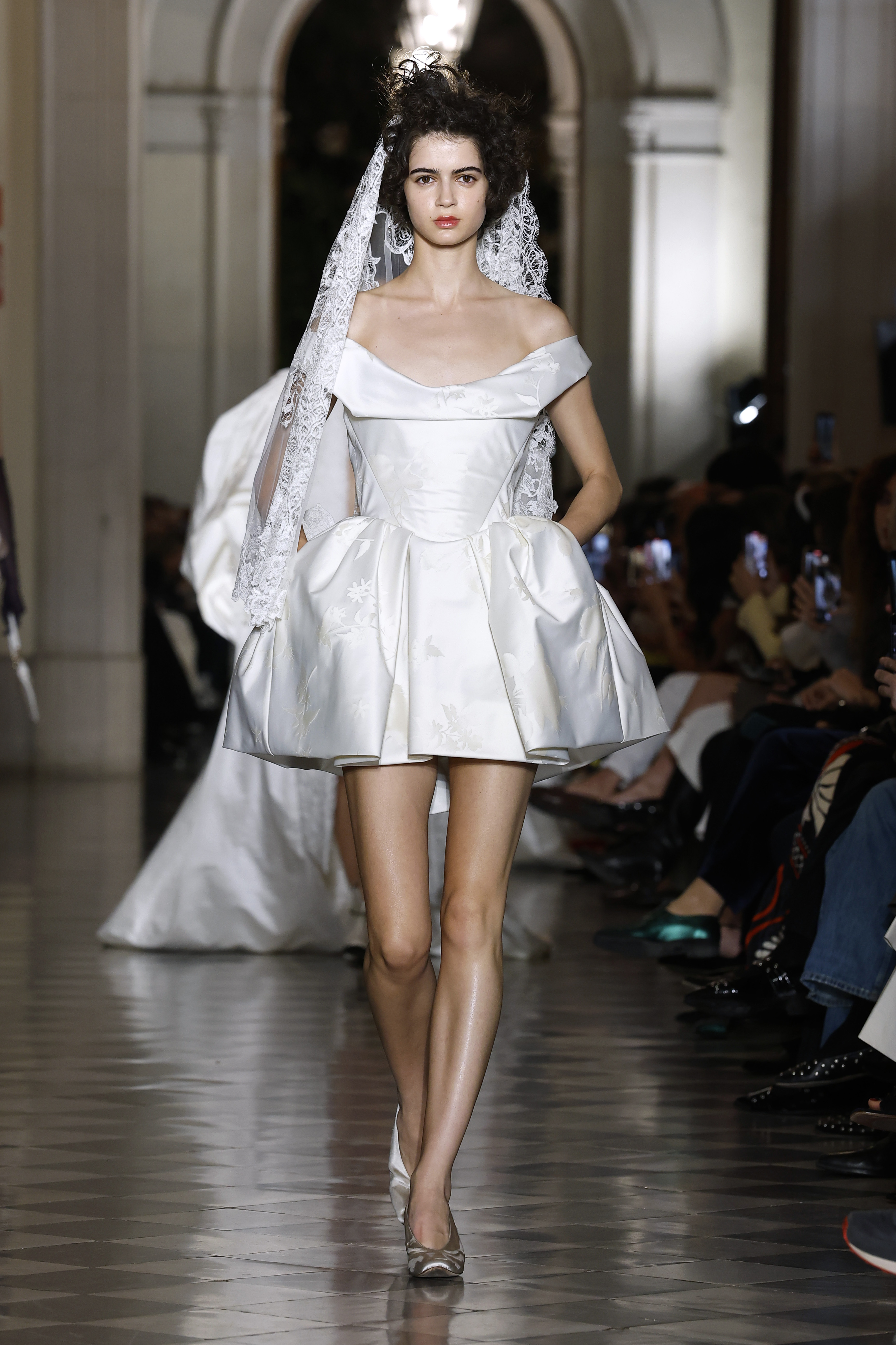 Model wears a mini wedding dress