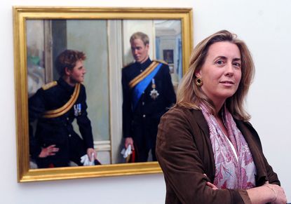 Artist Nicky Phillips stands beside a double portrait she painted of Prince William and Prince Harry which was unveiled at the National Portrait Gallery on January 6, 2010 in London, England.