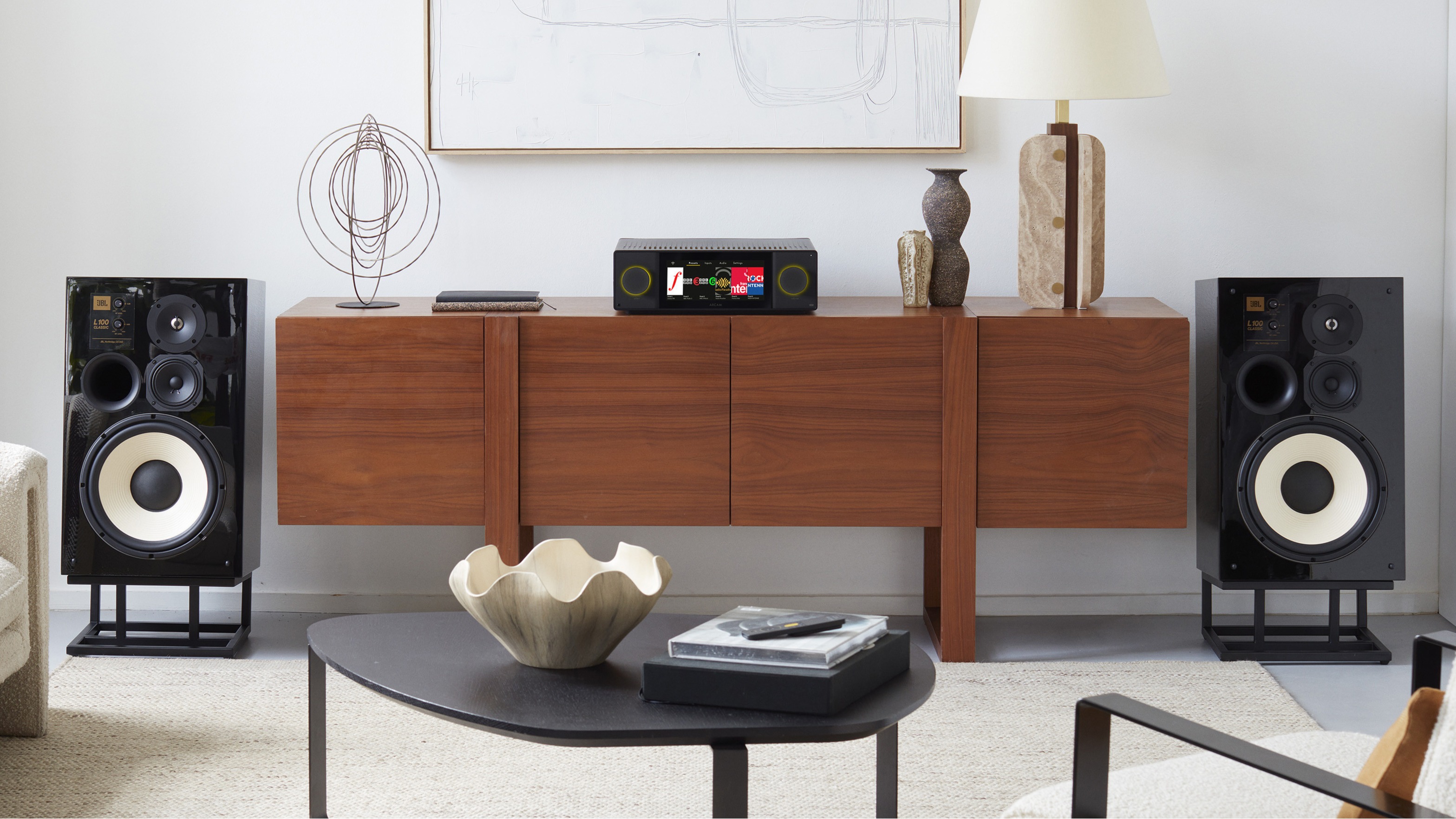 Arcam Radia SA45 flanked by a pair of JBL speakers