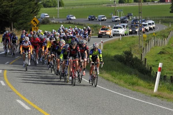 The tour convoy follows the race.